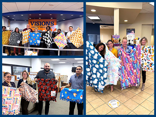 New Jersey employees pose with their homemade blankets for CASA.