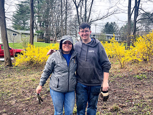 Visions volunteers, Megan and Andrew, in one of the yards they assisted cleaning up!