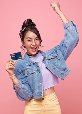 Teen Girl holding Visa Elite Credit Card