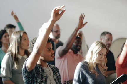 diverse-group-raising-hands