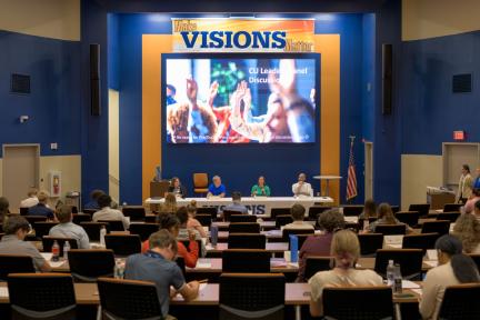 Audience of student interns at a panel discussion