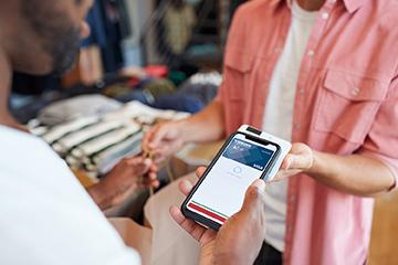 man using mobile pay with Platinum card
