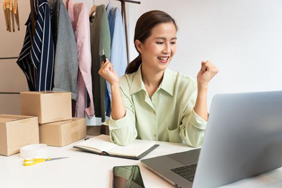 businesswoman excited at a computer