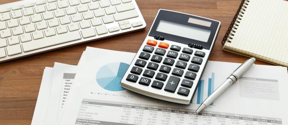 calculator and paperwork on desk