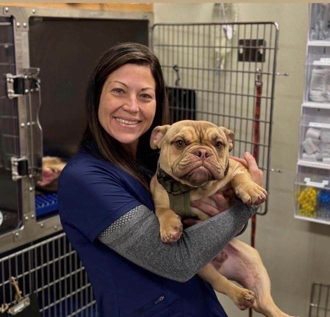 Picture of Dr. Bocek with a puppy