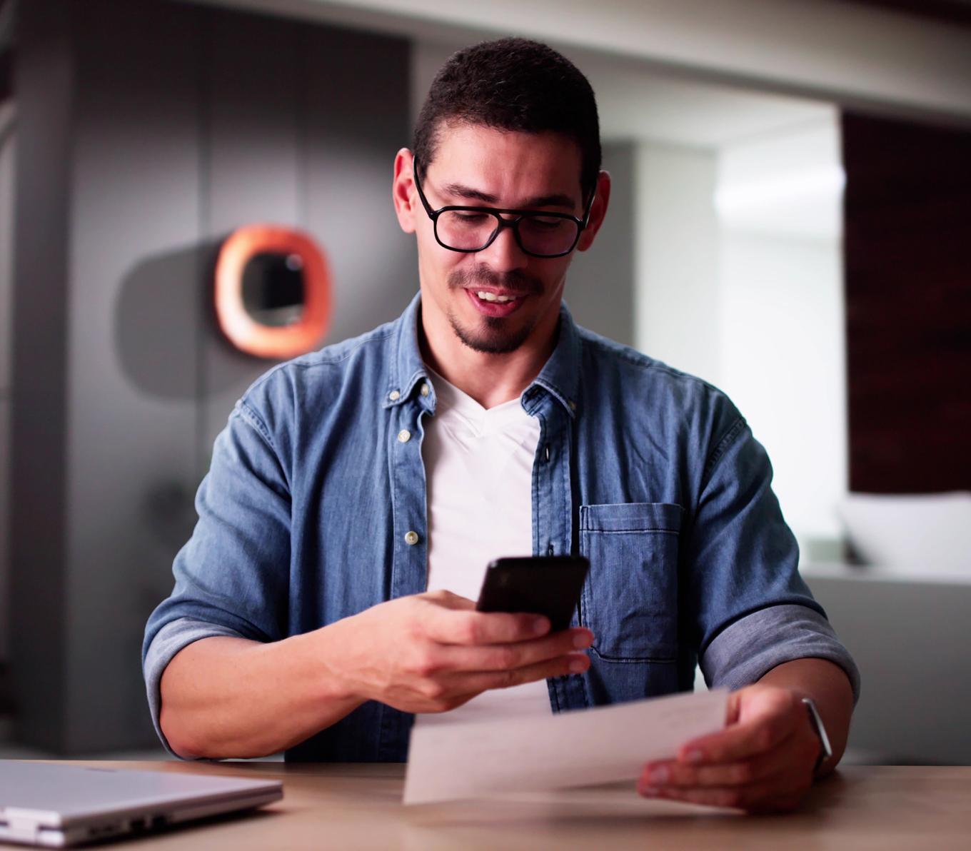 hispanic man using express deposit for a check