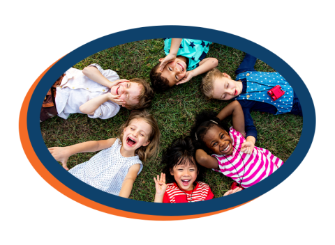 diverse kids happily lying in grass