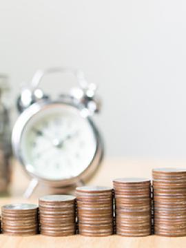 stacks of quarters growing larger left to right